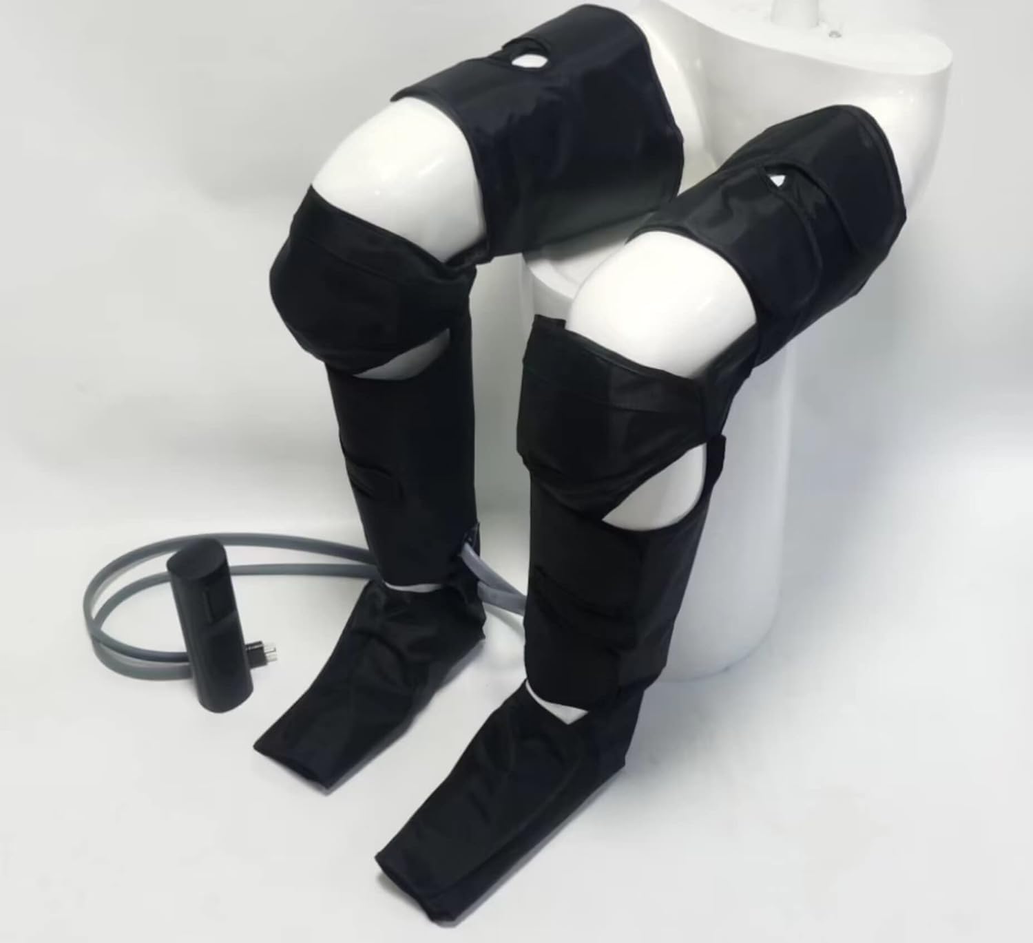 Air compression leg massager for circulation and pain relief; full-leg compression boots with adjustable extension straps for feet, calves, and thighs.